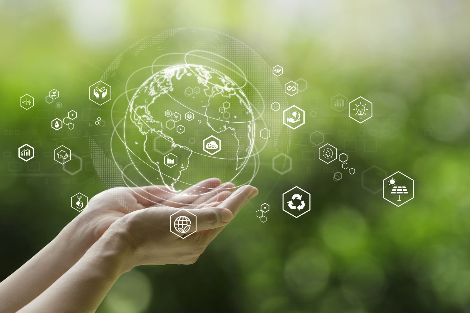Sustainable development goal (SDGs) concept.Hands holding Global communication network with Environment icon on a green background.Green technology and Environmental technology.ESG
