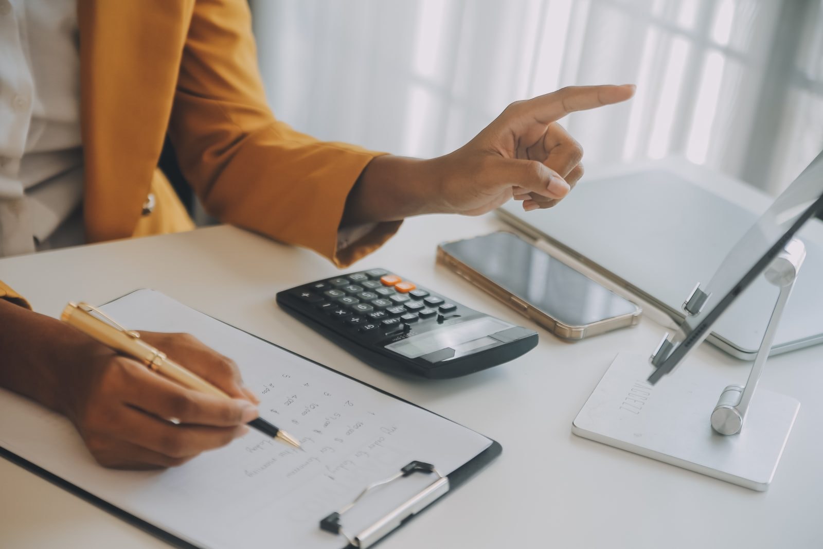 Startup SME small business entrepreneur of freelance Asian woman using a laptop with box Cheerful success happy Asian woman her hand lifts up online marketing packaging and delivery SME idea concept